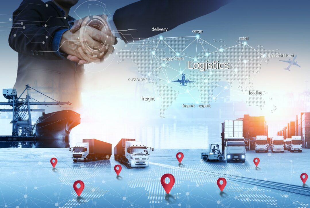 Business people shaking hands with global logistics iconography