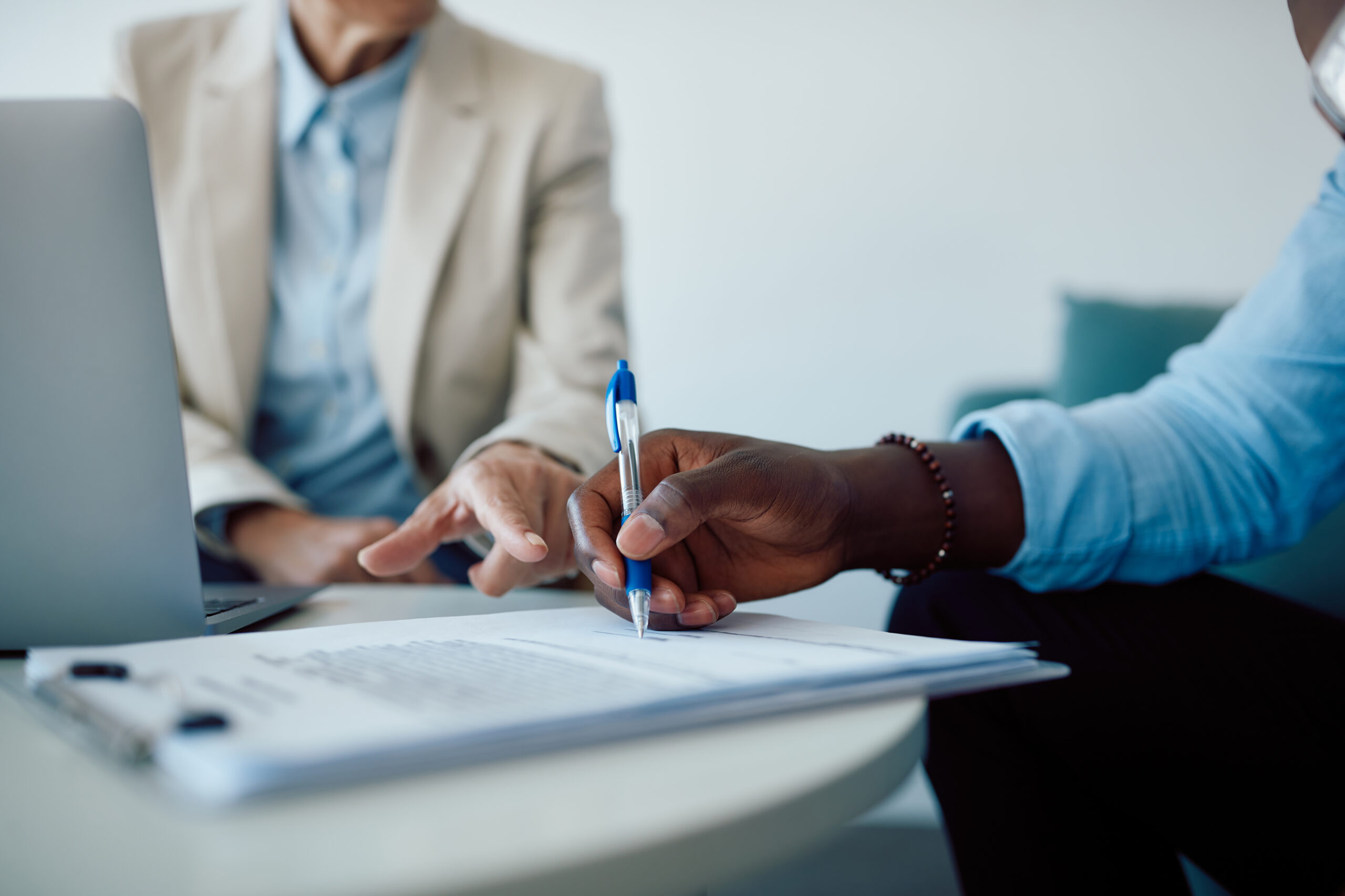 Two men reviewing paperwork