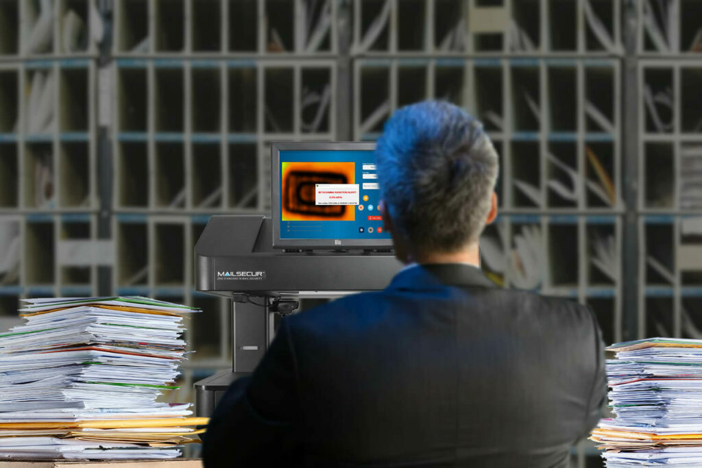 Advanced Detection Technology - person screening mail for potential threats